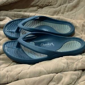 Woman’s blue flip flops